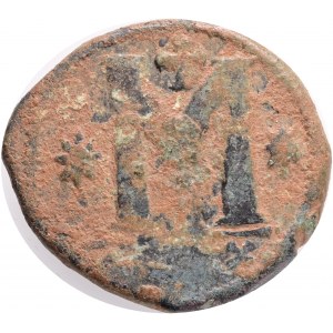 Byzantine, JUSTINIAN I (527-565),Theoupolis (Antioch) AE follis. Obv: D N IVSTINIANVS P P AVG.Diademed, draped and cuirassed bust right. Rev: Large M; star to left and right, cross above, A? below; +THЄЧºP+ in exergue. Ref: Sear 216. Bronze, Weight:14,9g