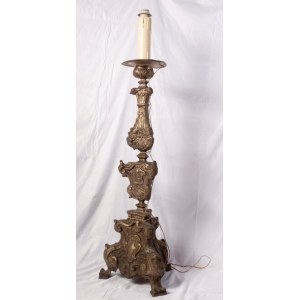 Altar candlestick late 18th early 19th century 100 x 32 cm in silver metal sheet. Embossed and engraved parts. Triangular shape with three zoomorphic support feet State of preservation: fair, broken and restored parts., Altar candlestick late 18th early 1