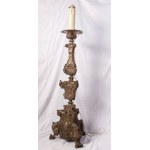 Altar candlestick late 18th early 19th century 100 x 32 cm in silver metal sheet. Embossed and engraved parts. Triangular shape with three zoomorphic support feet State of preservation: fair, broken and restored parts., Altar candlestick late 18th early 1