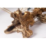 Lot of two electrified brass candlesticks first half of the 20th century 42 x 10 cm triangular in shape, Baroque style, raised parts with rocaille decoration State of preservation: very good, Lot of two electrified brass candlesticks first half of the 20t