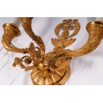 Lot of eight wall sconces second half of the 20th century of which: four two-light crystal and brass lamps, two three-light gilded bronze lamps with palmette decorations and two drop-shaped brass lamps. State of preservation: very good., Lot of eight wall