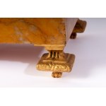 Pair of potiches second half of the 19th century 41 x 17 x 13 cm plinth base in yellow Siena marble with four quadrangular gilded bronze feet. Chalice stand in gilded bronze with a band of cupids along the body on a black background. State of preservation