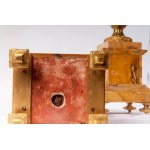 Pair of potiches second half of the 19th century 41 x 17 x 13 cm plinth base in yellow Siena marble with four quadrangular gilded bronze feet. Chalice stand in gilded bronze with a band of cupids along the body on a black background. State of preservation