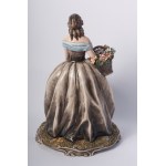 Girl with basket and flowers second half of the 20th century 39 x 23 x 23 cm sculpture modelled by casting in polychrome ceramic in the round. Italian manufacture, signature engraved in the paste at the bottom of the back. State of preservation: very good