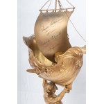Triton supporting a boat, volume sculpture 78 x 50 x 20 cm on a quadrangular leaf-shaped base in gilded metal. Gift with signature and dedication 29 June 1901 Condition: good, minimal wear to the gilding as per use over time, Triton supporting a boat, vol