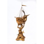 Triton supporting a boat, volume sculpture 78 x 50 x 20 cm on a quadrangular leaf-shaped base in gilded metal. Gift with signature and dedication 29 June 1901 Condition: good, minimal wear to the gilding as per use over time, Triton supporting a boat, vol