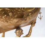 Triton supporting a boat, volume sculpture 78 x 50 x 20 cm on a quadrangular leaf-shaped base in gilded metal. Gift with signature and dedication 29 June 1901 Condition: good, minimal wear to the gilding as per use over time, Triton supporting a boat, vol