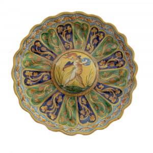 Crespina centerpiece late 19th century early 20th century 27 x 5 cm in polychrome ceramic, with a mixtilinear rim from which the ribs descend that end in the center of the strongly umboed plate. Polychrome decoration with vertical bands with floral elemen