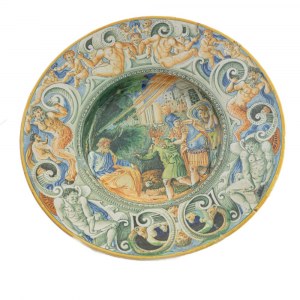Polychrome ceramic plate last quarter of the 19th century diameter 29 x 4.5 cm with a wide brim and a short flounce that ends in a large hollow. On the back, a lowered ring-shaped bottom. Decoration on the brim with nude male figures and satyrs. In the ho