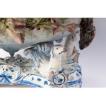 Polychrome ceramic centerpiece early 20th century 24 x 42 x 26 cm oval in shape with a central basket resting on four fantastic animals. Vase with floral barbotina decoration with trunk-shaped handles. At the base between the animals&#39; paws within circ