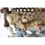 Polychrome ceramic centerpiece early 20th century 24 x 42 x 26 cm oval in shape with a central basket resting on four fantastic animals. Vase with floral barbotina decoration with trunk-shaped handles. At the base between the animals&#39; paws within circ