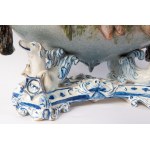 Polychrome ceramic centerpiece early 20th century 24 x 42 x 26 cm oval in shape with a central basket resting on four fantastic animals. Vase with floral barbotina decoration with trunk-shaped handles. At the base between the animals&#39; paws within circ