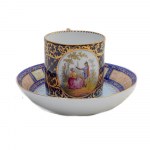 Polychrome porcelain liter cup, First half of the 19th century cup 6 x 6 cm: plate 13 x 3.5 cm blue background with genre figures within an oval reserve and decorations with latticework and racemes in pure gold. Square handle. Bowl-shaped plate with decor