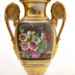 Pair of baluster vases, France, mid-19th century 26.5 x 7.3 x 7.3 cm with a short neck ending in a round foot resting on a quadrangular base. Above the shoulder, a flared opening on the rim and a pair of ring handles with figure medallions. Decoration in 