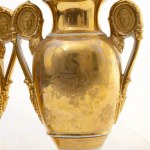 Pair of baluster vases, France, mid-19th century 26.5 x 7.3 x 7.3 cm with a short neck ending in a round foot resting on a quadrangular base. Above the shoulder, a flared opening on the rim and a pair of ring handles with figure medallions. Decoration in 