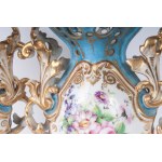 Pair of polychrome porcelain potiches France, second half of the 19th century 35 x 15 cm Baroque style with baluster body and flared shell-shaped foot and bud-shaped upper rim. Floral decoration within reserve on a white background with pure gold finishes