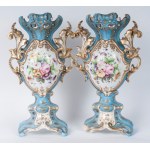 Pair of polychrome porcelain potiches France, second half of the 19th century 35 x 15 cm Baroque style with baluster body and flared shell-shaped foot and bud-shaped upper rim. Floral decoration within reserve on a white background with pure gold finishes