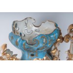 Pair of polychrome porcelain potiches France, second half of the 19th century 35 x 15 cm Baroque style with baluster body and flared shell-shaped foot and bud-shaped upper rim. Floral decoration within reserve on a white background with pure gold finishes