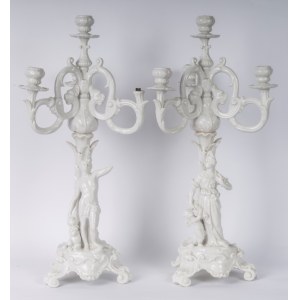 Pair of four-light candelabra 50 x 16 cm in Baroque style porcelain in white monochrome with base and rocailles accompanied by male and female characters with satyr and putto. Ginori manufacture, first half of the 20th century State of conservation: missi