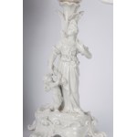 Pair of four-light candelabra 50 x 16 cm in Baroque style porcelain in white monochrome with base and rocailles accompanied by male and female characters with satyr and putto. Ginori manufacture, first half of the 20th century State of conservation: missi