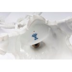 Pair of four-light candelabra 50 x 16 cm in Baroque style porcelain in white monochrome with base and rocailles accompanied by male and female characters with satyr and putto. Ginori manufacture, first half of the 20th century State of conservation: missi