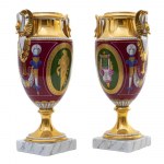 Pair of vases, France, mid-19th century 26 x 8 x 8 cm in polychrome porcelain, urn-shaped body ending with a round beaded foot on a square base. Funnel-shaped neck with a pair of swan-shaped handles. Reserve decorations on a red background with mule profi