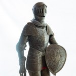 Scale model of armor late 19th early 20th century 78 x 34 x 10 cm in burnished iron, engraved parts, with oval shield. State of conservation: slight wear commensurate with use over time., Scale model of armor late 19th early 20th century 78 x 34 x 10 cm i