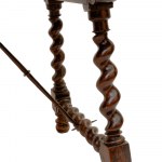 Goat-shaped table in walnut wood, 82 x 127 x 77 cm with four twisted legs, connected at the base by two wrought iron spears. Table with reassembled antique elements. Condition: good, wear and tear as per use over time., Goat-shaped table in walnut wood, 8