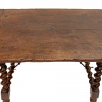 Goat-shaped table in walnut wood, 82 x 127 x 77 cm with four twisted legs, connected at the base by two wrought iron spears. Table with reassembled antique elements. Condition: good, wear and tear as per use over time., Goat-shaped table in walnut wood, 8
