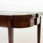 Mahogany book-style table late 19th century closed 73 x 91 x 45 cm; open 71 x 91 x 90 cm rectangular in shape with rounded corners and four tapered legs. Red cloth top, geometric decorative elements with fruitwood fillets along the top band and on the leg
