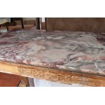 Carved and gilded wooden centre table 19th century 85 x 123 x 63 cm with plant motifs. Zoomorphic support foot connected to the base by a crossed motif. Breccia delle Alpi marble top. State of preservation: several points of the gilding have fallen off, C