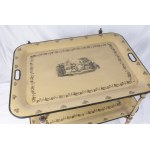 Folding table first quarter of the 20th century 57 x 82 x 82 cm in pistachio green lacquered metal with black finishes. It features two food trays per shelf decorated with floral motifs and a genre scene en suite with the table uprights. State of preserva