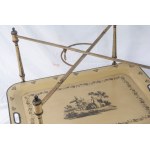 Folding table first quarter of the 20th century 57 x 82 x 82 cm in pistachio green lacquered metal with black finishes. It features two food trays per shelf decorated with floral motifs and a genre scene en suite with the table uprights. State of preserva