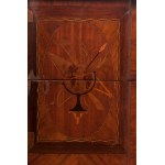 Two-drawer chest of drawers first half of the 20th century 80 x 84 x 42 cm rectangular in shape with a projecting front and four sabre legs. In mahogany veneered wood. Geometric fruitwood finishes and central medallion on the front with line inlaid measur
