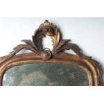 Pair of wall mirrors early 19th century 64 x 33 cm with gilded wooden candle holder. Rectangular shape with rounded corners, floral decoration at the base and at the top cymatium with curly leaf fronds. State of conservation: wear to the glass and gilding