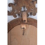 Oval shaped mirror in gilded and carved wood 19th century 114 x 56 x 9 cm with leaf-shaped top and legs with shell and scrolls. Angel heads decorate the frill of the mirror. State of conservation: some missing gilding., Oval shaped mirror in gilded and ca