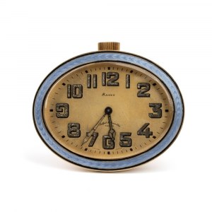 Art Déco gilded and enamel table clock Great Britain, 1910s - 1920s Height x width x depth: 7.3 x 8.6 x 1.8 cm. Weight: 259.1 g. Gilded and lavander guilloché enamels case, round shape. Golden color dial with Arabic numerals bearing the iscriptions 8 DAY