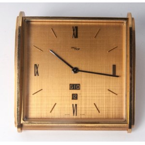 IMHOF Brass Table Clock second half of the 20th century 18 x 19 cm rectangular shape, brass dial with Roman numerals at the axes, day of the week and date at six o&#39;clock. Manual winding. Condition: good, machine working, IMHOF Brass Table Clock second