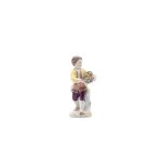 BOY WITH A BASKET OF FLOWERS | MEISSEN (GERMANY / GERMAN 20TH CENTURY)
