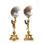 A pair of nautilus shells mounted on bronze bases