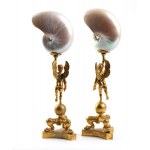 A pair of nautilus shells mounted on bronze bases