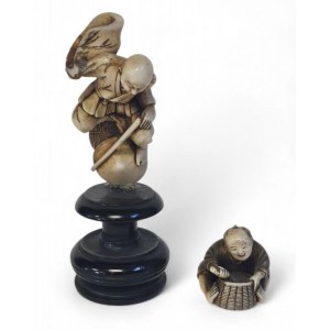 A pair of Japanese ivory okimono