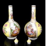 A pair of porcelain lidded vases