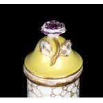 A pair of porcelain lidded vases