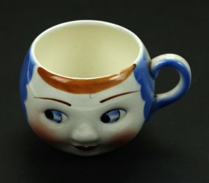 Head-shaped mug, Chodzież, 1930s. Blue (418)