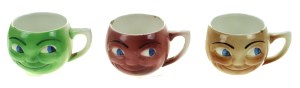 Three head-shaped mugs, 1930s. (419)