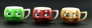 Three head-shaped mugs, 1930s. (419)