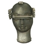 Brooch with a woman