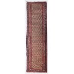 Kurdish carpet decorated with stylized floral motifs