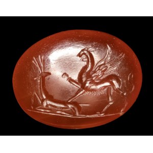 A Roman carnelian intaglio. Griffin with deer.